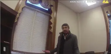  ??  ?? Screengrab from body camera footage of police investigat­ing a reported break-in at the office of Trenton Mayor’s chief of staff Yoshi Manale, seen here in his office.