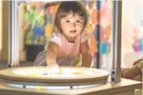  ??  ?? Children can play at a light table.