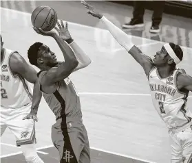  ?? Sue Ogrocki / Associated Press ?? Rockets guard Victor Oladipo, who had 15 points and seven assists, shoots over Thunder guard Shai Gilgeous-Alexander in the second half on Monday.