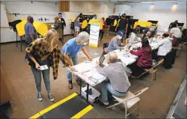  ?? Al Seib Los Angeles Times ?? VOTERS CAST their ballots as polls open at Santa Monica College on election day Tuesday to decide whether or not to recall Gov. Gavin Newsom.