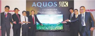  ??  ?? Ohyama (third from right) and other Sharp executives presenting the Sharp Aquos 8K TV at the launch event.