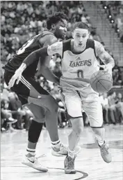  ?? Ethan Miller Getty Images ?? KYLE KUZMA, right, had 30 points and 10 rebounds in the championsh­ip game, making 11 of 16 shots.