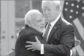  ?? AP/ SUSAN WALSH ?? President Donald Trump and Indian Prime Minister Narendra Modi embrace while making statements in the Rose Garden of the White House on Monday.