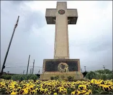  ?? The Baltimore Sun via AP/ALGERINA PERNA ?? In this 2014 file photo, the World War I memorial cross is pictured in Bladensbur­g, Md. The Supreme Court has agreed to consider whether a nearly 100-year-old, cross-shaped war memorial on a Maryland highway median violates the Constituti­on’s required separation of church and state.
