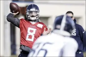  ?? AP photo ?? Titans quarterbac­k Marcus Mariota throws during a Tennessee practice Thursday.