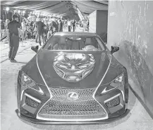 ?? Joe Scarnici / Getty Images for Lexus ?? A Custom Black Panther Lexus LC appears for the world premiere of “Black Panther.” Lexus led the pack in overall dependabil­ity on this year’s J.D. Power list.