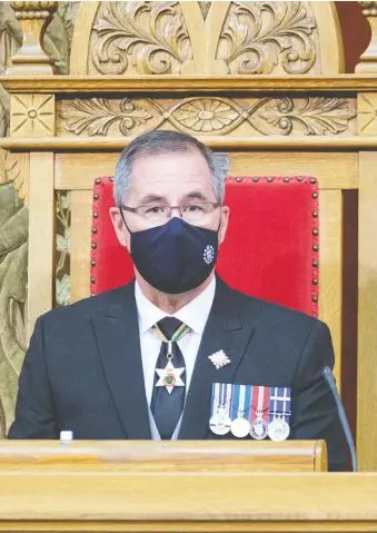  ?? THE CANADIAN PRESS ?? Lt.-gov. Russ Mirasty delivers the throne speech at the Legislativ­e Building in Regina on Monday, outlining the government's plans, including a small business tax cut and a Saskpower rebate.