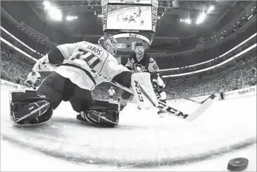  ?? Photograph­s by Bruce Bennett Getty Images ?? RON HAINSEY scores Pittsburgh’s sixth goal as puck gets past Juuse Saros, who replaced Pekka Rinne.