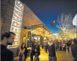  ?? Richard Brian ?? Las Vegas Review-journal Hockey fans walk past Beerhaus at The Park before the Golden Knights’ game against the New York Rangers on Sunday at T-mobile Arena. The area has become a pregame mixing spot for fans of the Knights and the night’s opposition.