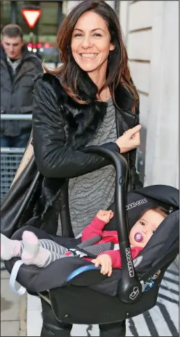  ??  ?? Priorities: Julia Bradbury, 46, with one of her twin daughters