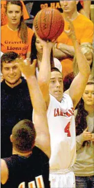  ?? MARK HUMPHREY ENTERPRISE-LEADER ?? Farmington’s Skyler Barnes elevates for a 3-point shot from the left wing over Gravette’s Jackson Soule. Farmington won 65-48 to advance into the District championsh­ip.