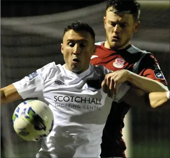  ??  ?? Drogheda’s Chris Lyons hold the ball up during Saturday night’s game with Cobh Ramblers.