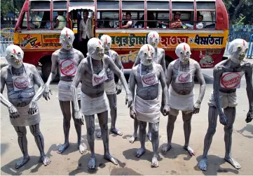  ??  ?? Participan­ts of an anti-tobacco awareness campaign pose before the start of their event to mark ‘World No Tobacco Day’ in Kolkata, India. — Reuters photo