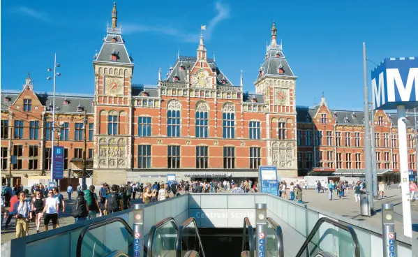  ?? RICK STEVES ?? Amsterdam Centraal train station is the starting point for any Amsterdam adventure: history, famous art or mayonnaise-slathered fries.