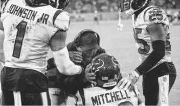  ?? Brett Coomer / Staff photograph­er ?? Texans coach David Culley and cornerback Terrance Mitchell celebrate Mitchell’s intercepti­on Sunday.