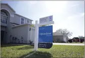  ?? PHELAN M. EBENHACK — AP PHOTO ?? Real estate signs are posted outside homes for sale on Feb. 21 in Valrico, Fla.