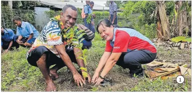  ?? ?? 1 1. Ministry of Forestry permanent secretary Rovereto Nayacalevu and an OISCA Internatio­nal rep plant a tree at Conua District School in Nadroga.