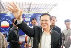  ?? HENG CHIVOAN ?? Kem Sokha waves to supporters at a youth event at the party’s headquarte­rs in Phnom Penh earlier this week.