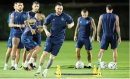  ?? /ROBERT CIANFLONE / GETTY IMAGES ?? Lionel Messi of Argentina warms up during the Argentina MD-1 training session at Qatar University in Doha, Qatar.