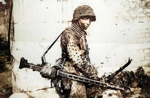  ??  ?? The finished article. This young machine-gunner of the Hitlerjuge­nd is carrying the feared MG42 (Jonathan Trigg)