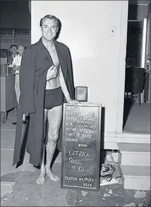  ??  ?? CARY GRANT pauses for a wardrobe shot for the ’ 57 film “An Affair to Remember.” Note the less- than- glamorous backdrop.