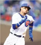  ?? GETTY IMAGES ?? Javy Baez seems more interested in winning the division title than the race for MVP with Brewers star Christian Yelich.