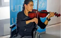  ?? AP ?? Bassel Mokdad, 17, who is paralysed from a spinal injury, plays a violin at a press conference in Beirut last week. —