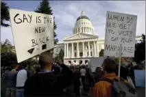  ?? ROBERT DURELL — THE ASSOCIATED PRESS FILE ?? Protesters gather on the west steps of the state Capitol in Sacramento on Nov. 22, 2008, to protest the passage of Propositio­n 8, which banned the state from recognizin­g same-sex marriages.