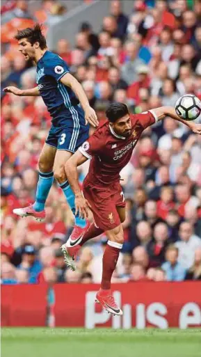  ?? REUTERS PIC ?? Middlesbro­ugh’s George Friend (left) and Liverpool’s Emre Can vie for the ball at Anfield on Sunday.