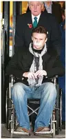  ?? ?? ANGUISH Russell leaving hospital after 2007 brain op