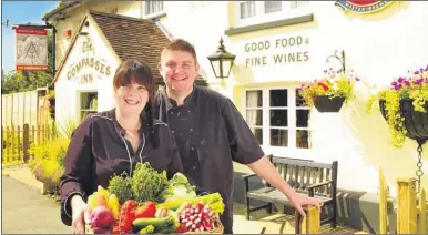  ??  ?? Licensees Donna and Robert Taylor at The Compasses Inn