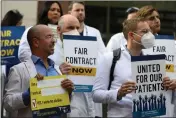  ?? FRANCINE ORR — LOS ANGELES TIMES ?? Dozens of physicians, dentists and psychiatri­sts demonstrat­e outside the Kenneth Hahn Hall of Administra­tion in Los Angeles on Nov. 7.