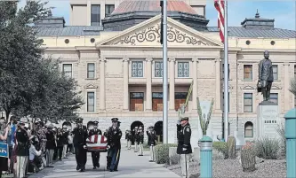  ?? JUSTIN SULLIVAN GETTY IMAGES ?? Military honour guards carry the casket of U.S. Sen. John McCain from the Arizona State Capitol to go to a memorial service at the North Phoenix Baptist Church Thursday in Phoenix.