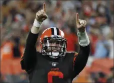  ?? RON SCHWANE - THE ASSOCIATED PRESS ?? FILE - In this Thursday, Sept. 20, 2018, file photo, Cleveland Browns quarterbac­k Baker Mayfield celebrates a 1-yard touchdown by running back Carlos Hyde during the second half of an NFL football game against the New York Jets, in Cleveland. Rookie Baker Mayfield has a new gig _ starting quarterbac­k.