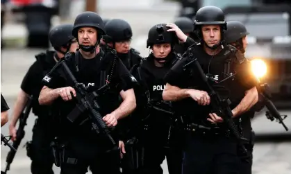  ?? Photograph: CJ Gunther/EPA ?? A police Swat team deploys in Massachuse­tts. The mayor of Boston has been one of numerous politician­s to be a victim of ‘swatting’ in recent months.