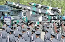  ?? | AFP ?? AN IRANIAN military truck carries missiles during a military parade celebratin­g the country’s annual Army Day in Tehran yesterday.