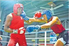  ?? Picture: BALJEET SINGH ?? Boxing is among sports promoting the involvemen­t of women. Meanwhile, Aminiasi Saratibau (left) fights Ilaijia Yalikitoga during the Western Amateur Boxing
competitio­n in Nadi.