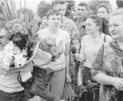  ?? Efrem Lukatsky / Associated Press ?? Ukrainian jailed pilot Nadezhda, center, speaks to the media Wednesday upon her arrival at Boryspil airport outside Kiev, Ukraine, after a prisoner swap arranged with Moscow.