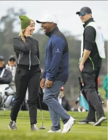  ?? Photos by Eric Risberg / Associated Press ?? Former Miss America Kira Kazantsev (left) and actor Alfonso Ribeiro laugh it up on the sixth green at Pebble Beach.