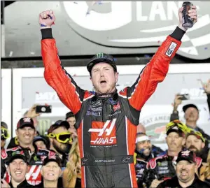  ?? AP/CHUCK BURTON ?? Kurt Busch weaved his way past Kyle Larson in turns 1 and 2 on the final lap to win the Daytona 500 for the first time in 16 tries Sunday at Daytona Internatio­nal Speedway in Daytona Beach, Fla.