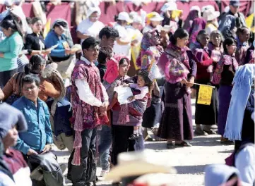  ??  ?? People look on as Pope Francis celebrates a Mass in San Cristobal de las Casas. — Reuters photo