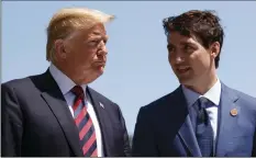  ??  ?? In this June 8 file photo, President Donald Trump talks with Canadian Prime Minister Justin Trudeau during a G-7 Summit welcome ceremony in Charlevoix, Canada. AP PHOTO/EVAN VUCCI