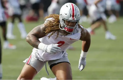  ?? Associated Press ?? “We definitely don’t dwell on last season,” said Ohio State defensive end Chase Young, above in preseason practice. The Buckeyes finished ninth in total defense in the Big Ten in 2018.