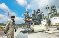  ?? REUTERS ?? A worker monitors operations at a refurbishe­d oil refinery in Esmeraldas, Ecuador, South America, on Dec 17, 2015.