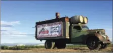  ?? AP PHOTO / GILLIAN FLACCUS ?? An advertisem­ent for a festival built around the Aug. 21 total solar eclipse sits alongside a busy road leading into Madras, Oregon on June 13.