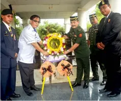  ??  ?? Laying the wreath at the tomb of Tun Jugah. From left are Billy, Jamit, Kassim, Philip and Martin.