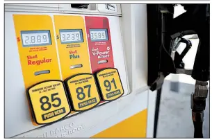  ?? AP ?? A pump at a Shell station in southeast Denver in May displays prices for the three grades of gasoline. The consumer price index in May advanced at the fastest pace in 6 years.