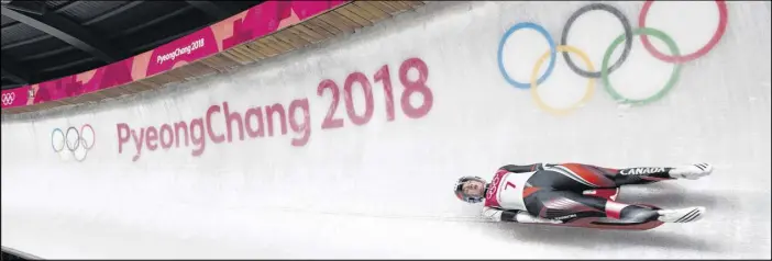 ?? THE CANADIAN PRESS/NATHAN DENETTE ?? Kimberley Mcrae of Canada competes in heat two of women’s single luge during the 2018 Olympic Winter Games in Pyeongchan­g, South Korea on Monday.