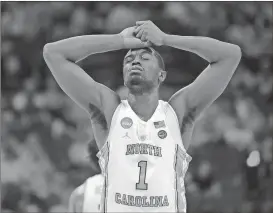  ??  ?? North Carolina’s Theo Pinson (1) reacts after a second-round game against Texas A&M in the NCAA men’s college basketball tournament in Charlotte, N.C., Sunday, March 18, 2018. (AP Photo/Gerry Broome)