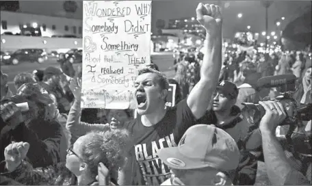  ?? Allen J. Schaben Los Angeles TImes ?? IAN JAMESON, a member of Pasadenans and Altadenans Against Police Violence, shouts at a Trump supporter in Beverly Gardens Park.